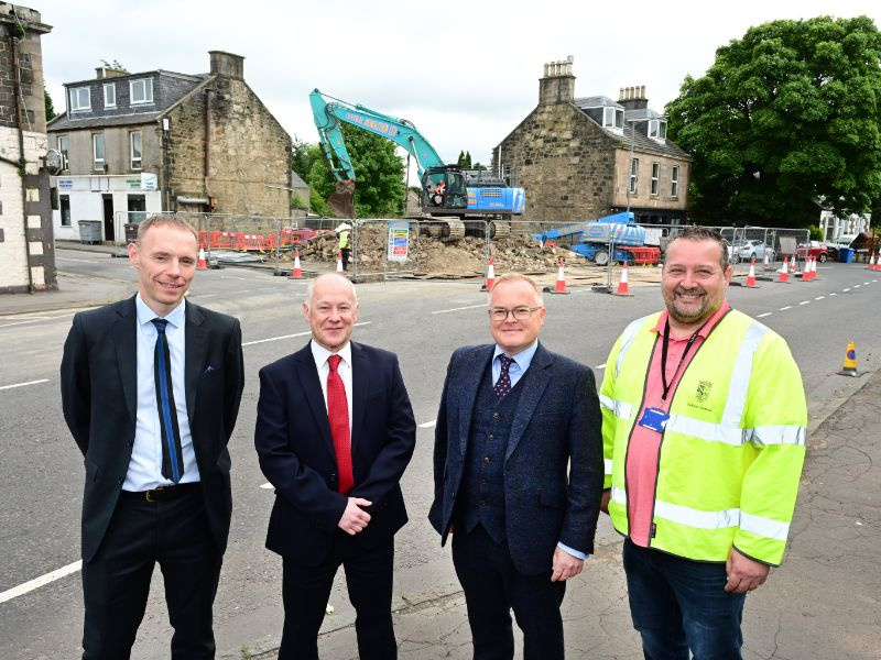 Members of the KLTR stood in front of a demolished hotel in Fife that has been transferred to the Local Authority